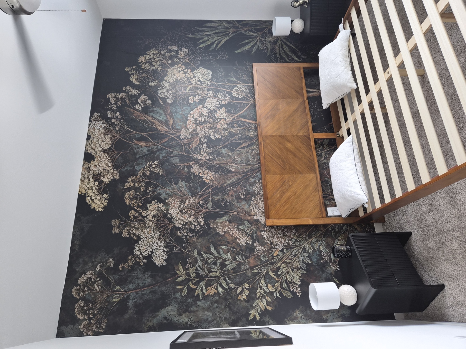 Bedroom furniture assembly with bed frame, nightstands and wallpapered accent wall