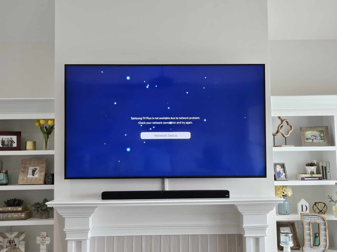 Large TV mounted over fireplace